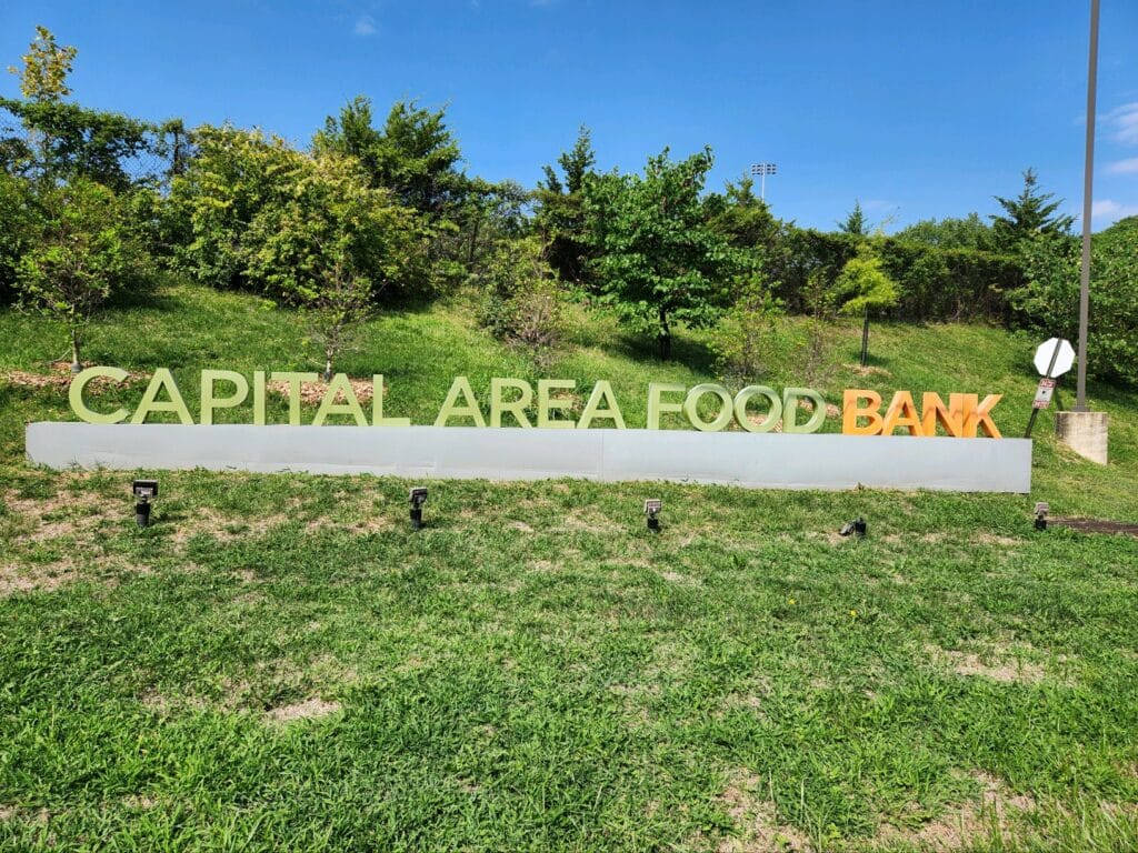 Capital Area Food Bank sign, the organization where CBM's food drive donations were given.
